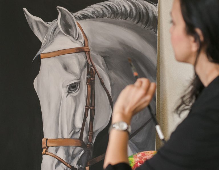 Sobia's painting a horse